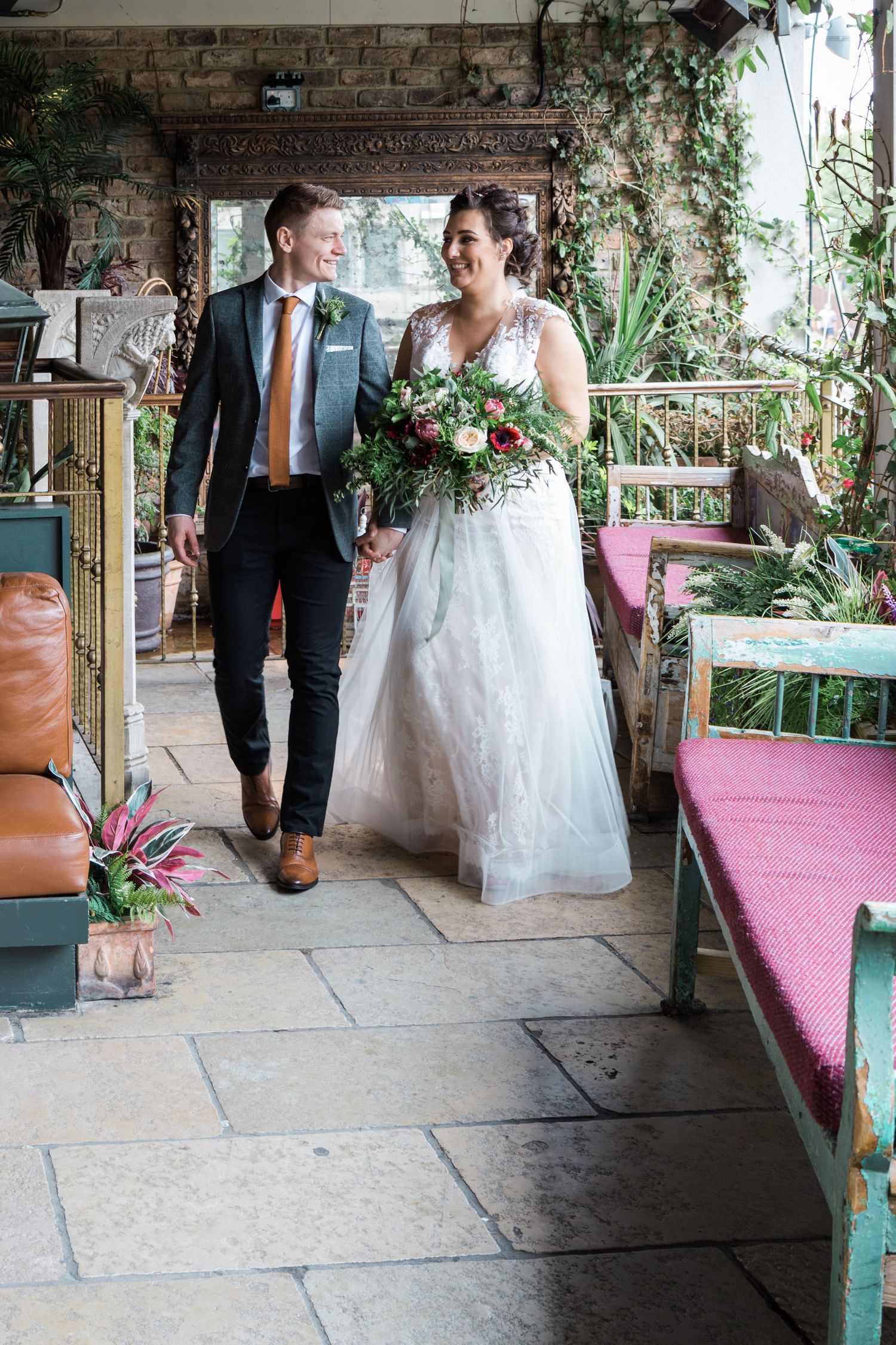Bride and groom walking through stylish interior at As You Like It Newcastle wedding venue Newcastle