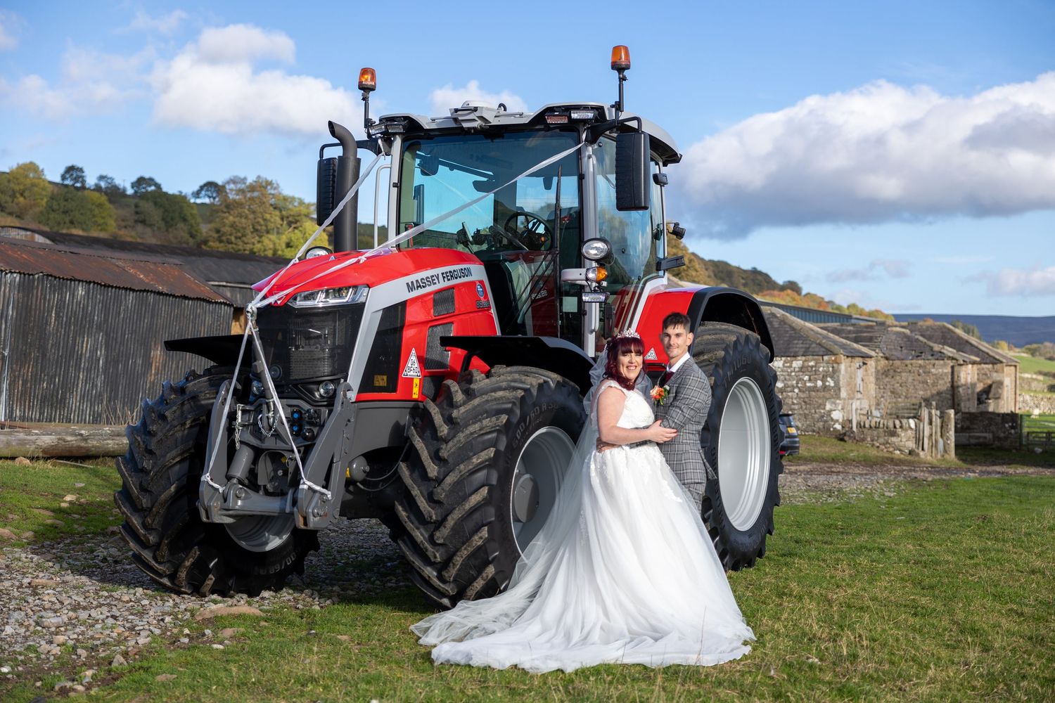 Rustic countryside wedding at Wolsingham featuring a decorated Massey Ferguson tractor backdrop.