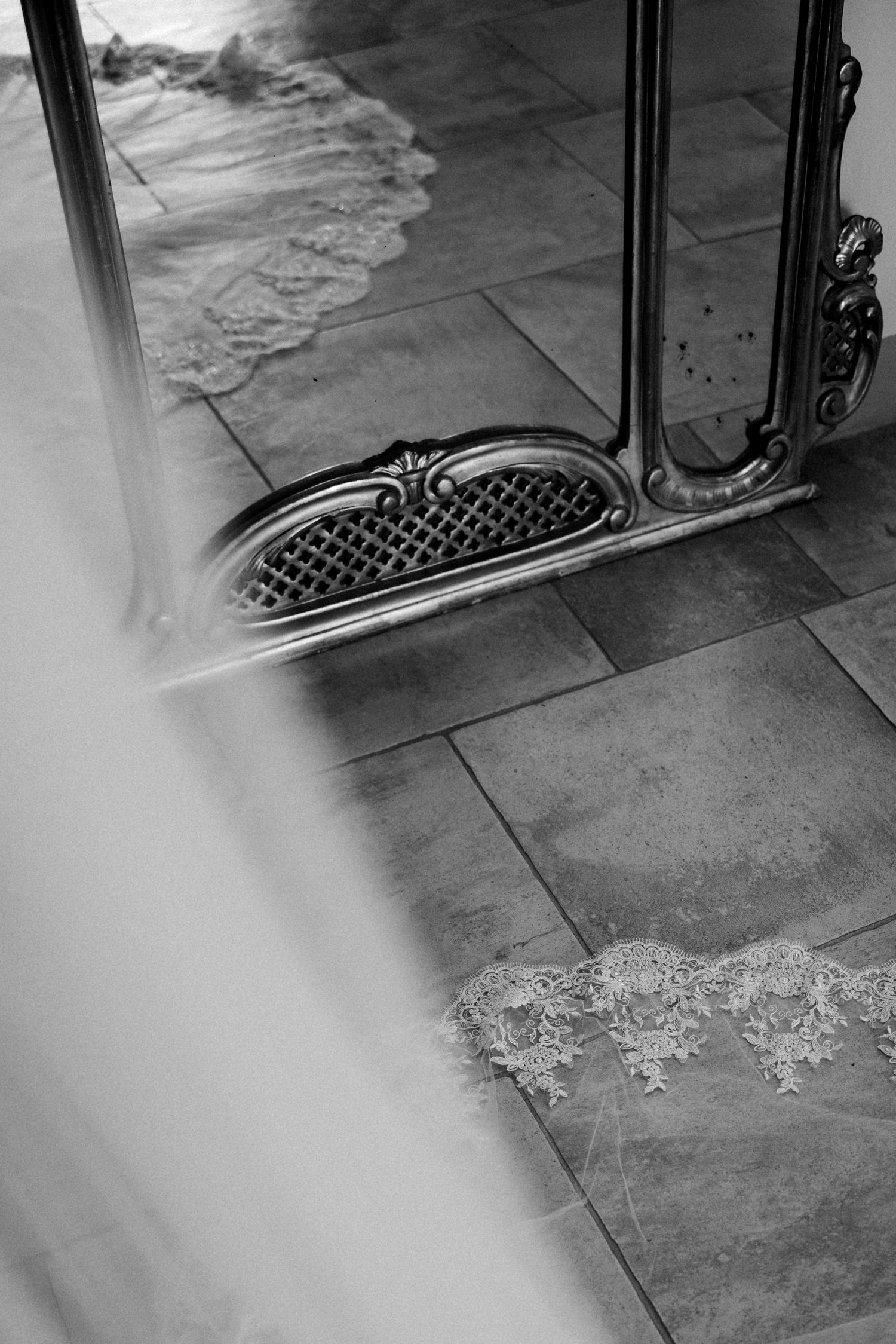 Ornate vintage mirror reflections on a tiled floor creating an artistic pattern.