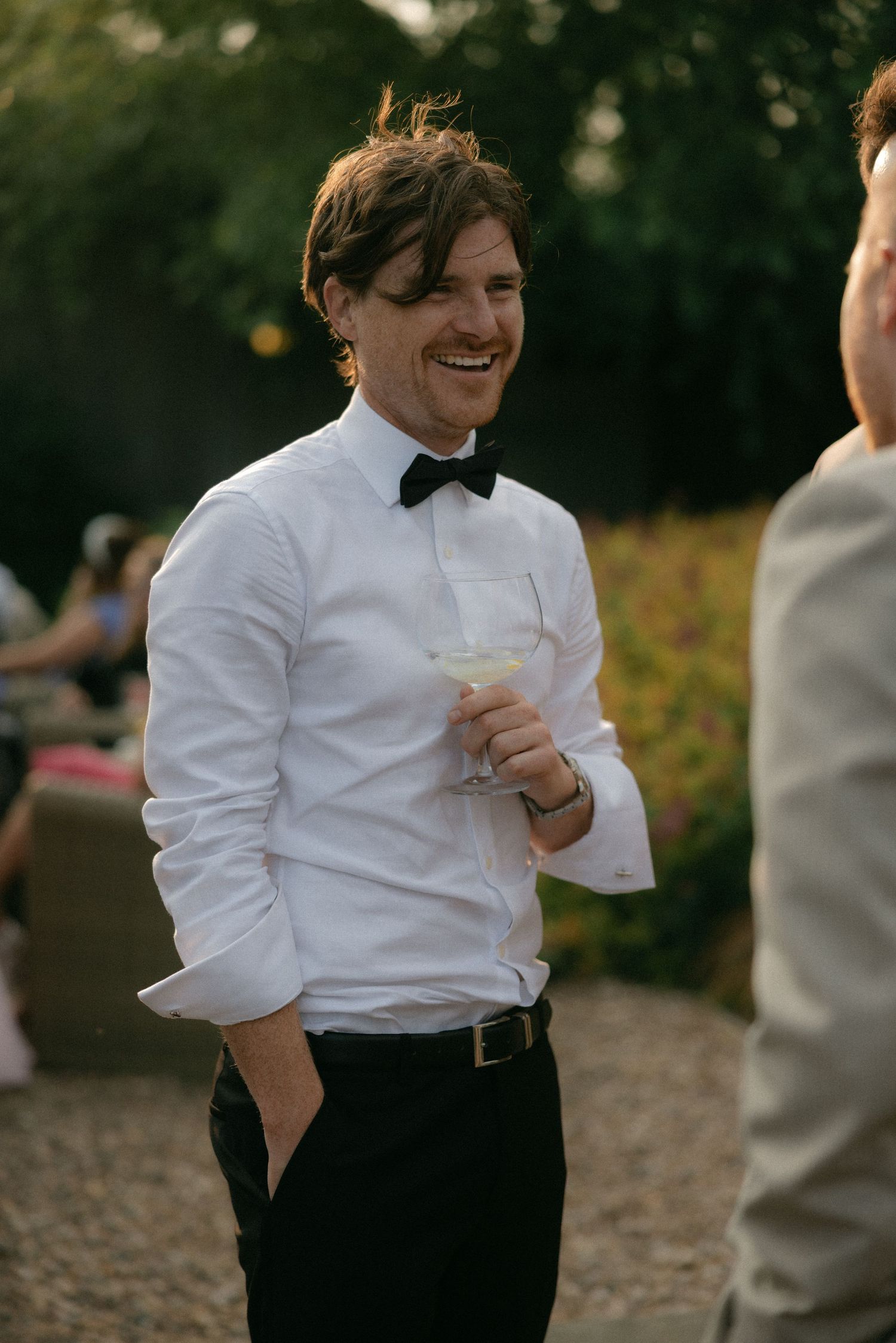 A candid moment of laughter during a wedding reception.