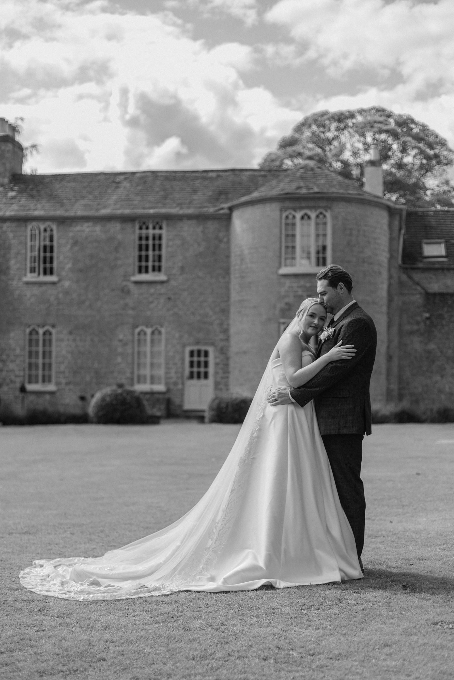 A romantic black and white wedding portrait series taken on the grounds of a historic mansion.
