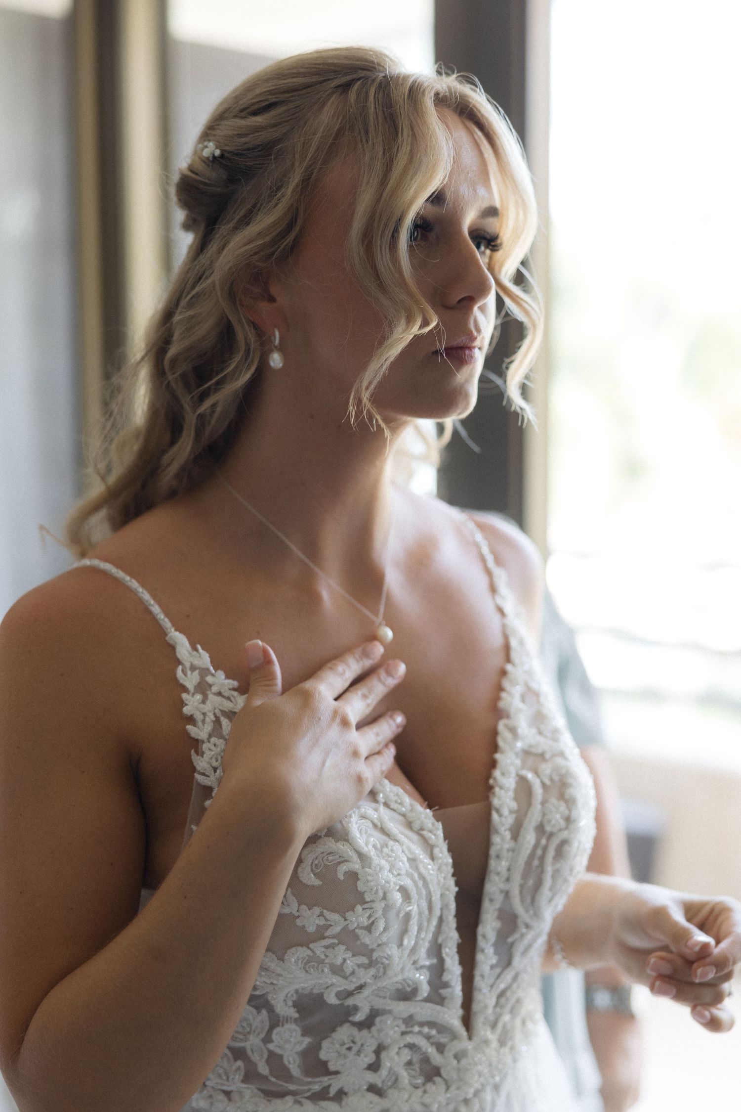 Emotional wedding preparation moments captured in a series of candid photographs.
