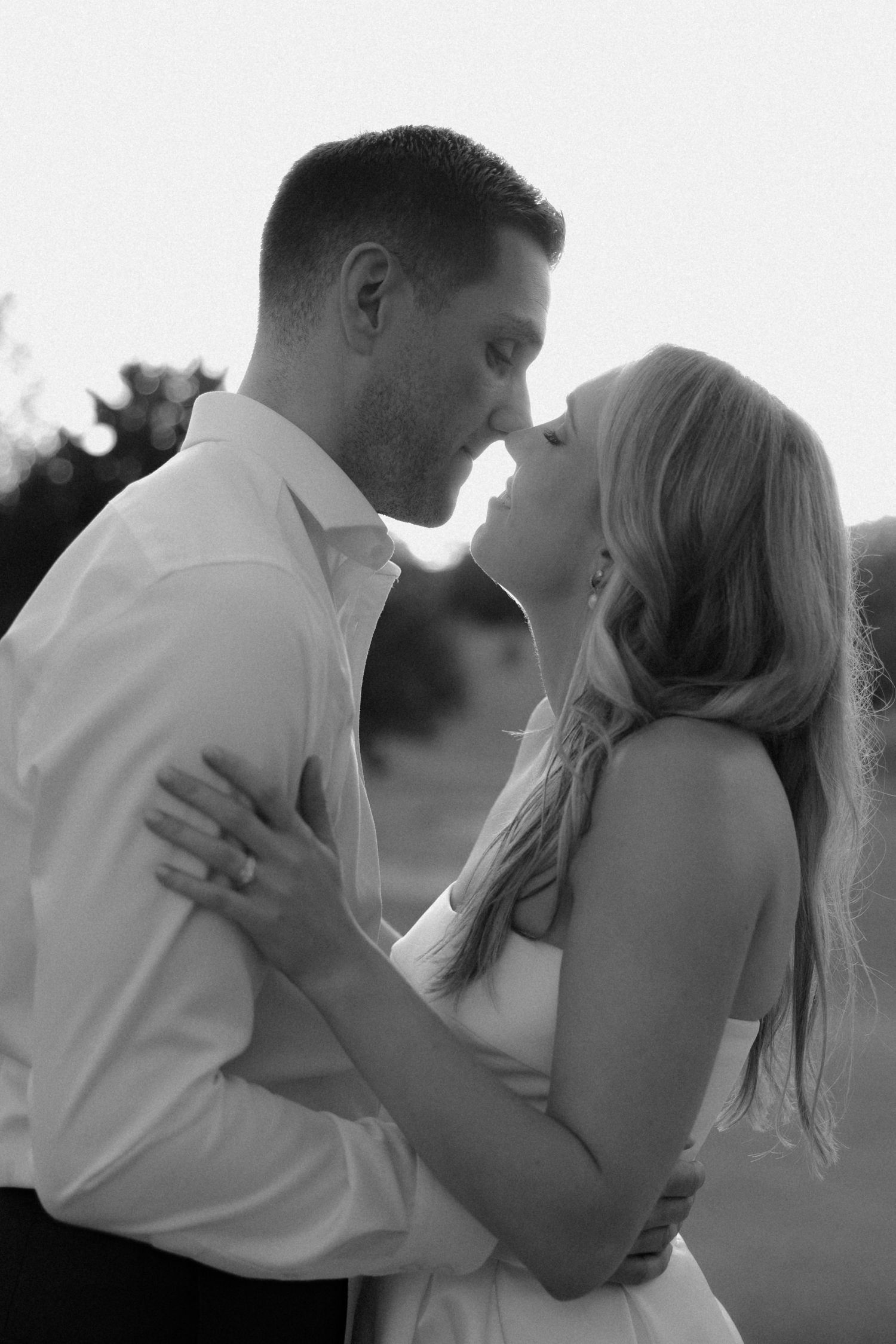 Black and white series of intimate wedding portraits showing tender moments between newlyweds.