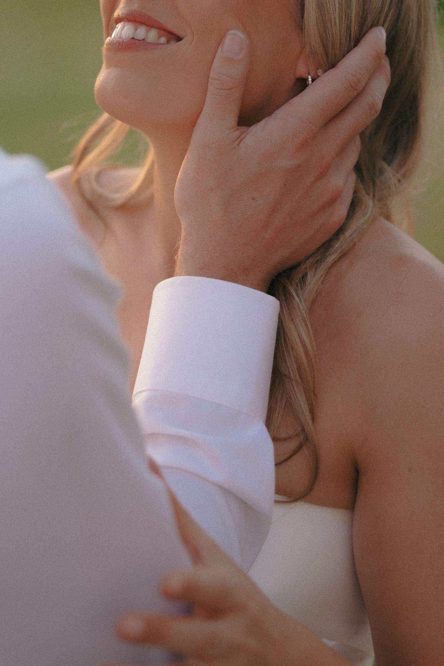 Intimate close-up shots of gentle touches and tender moments during a wedding photoshoot.