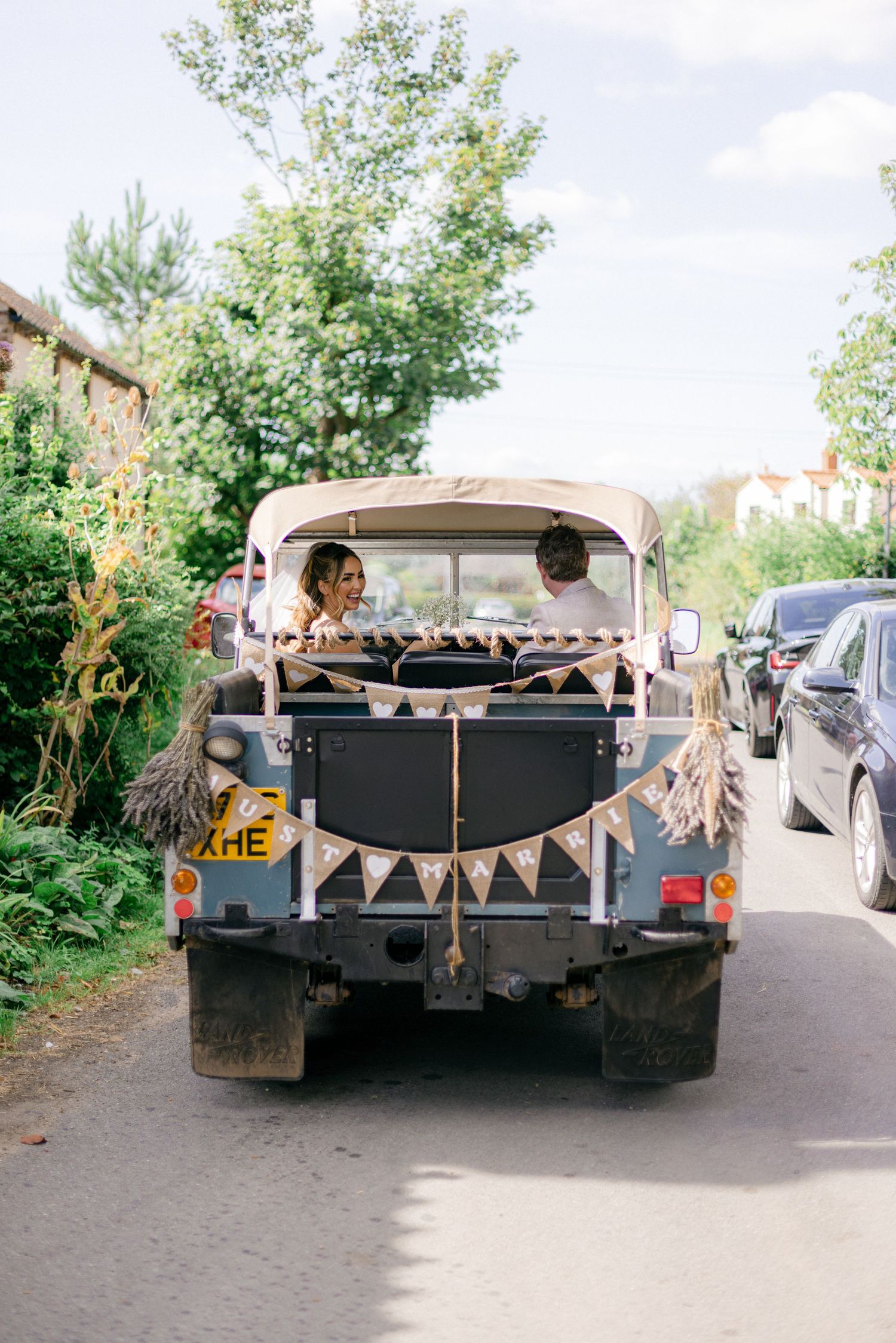 A vintage truck decorated with wedding bunting and banners photographed from different angles.