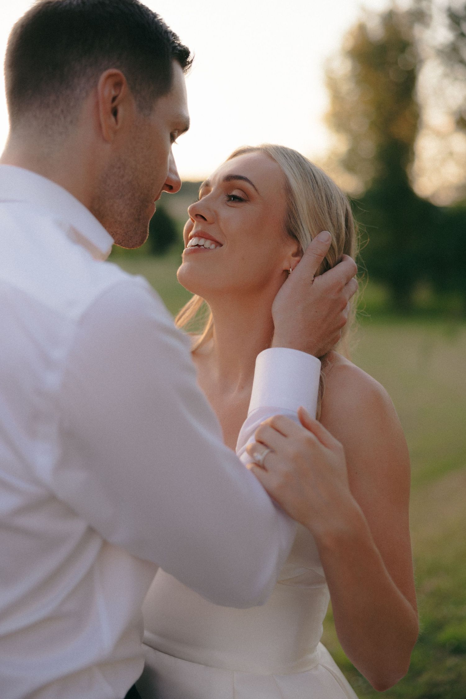 Close-up sequence of tender moments between a bride and groom in natural lighting.