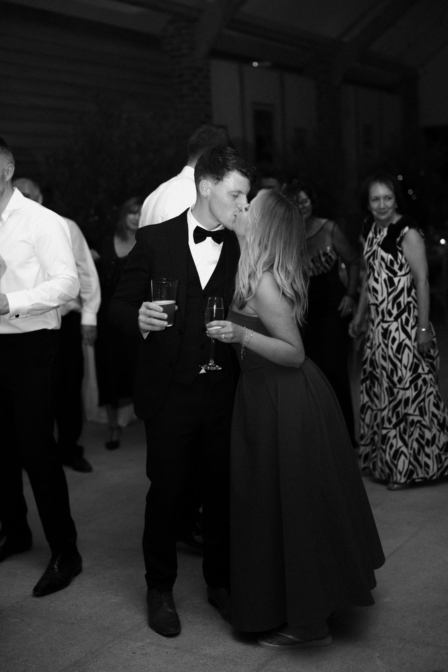 Couples dancing together at an elegant evening reception.