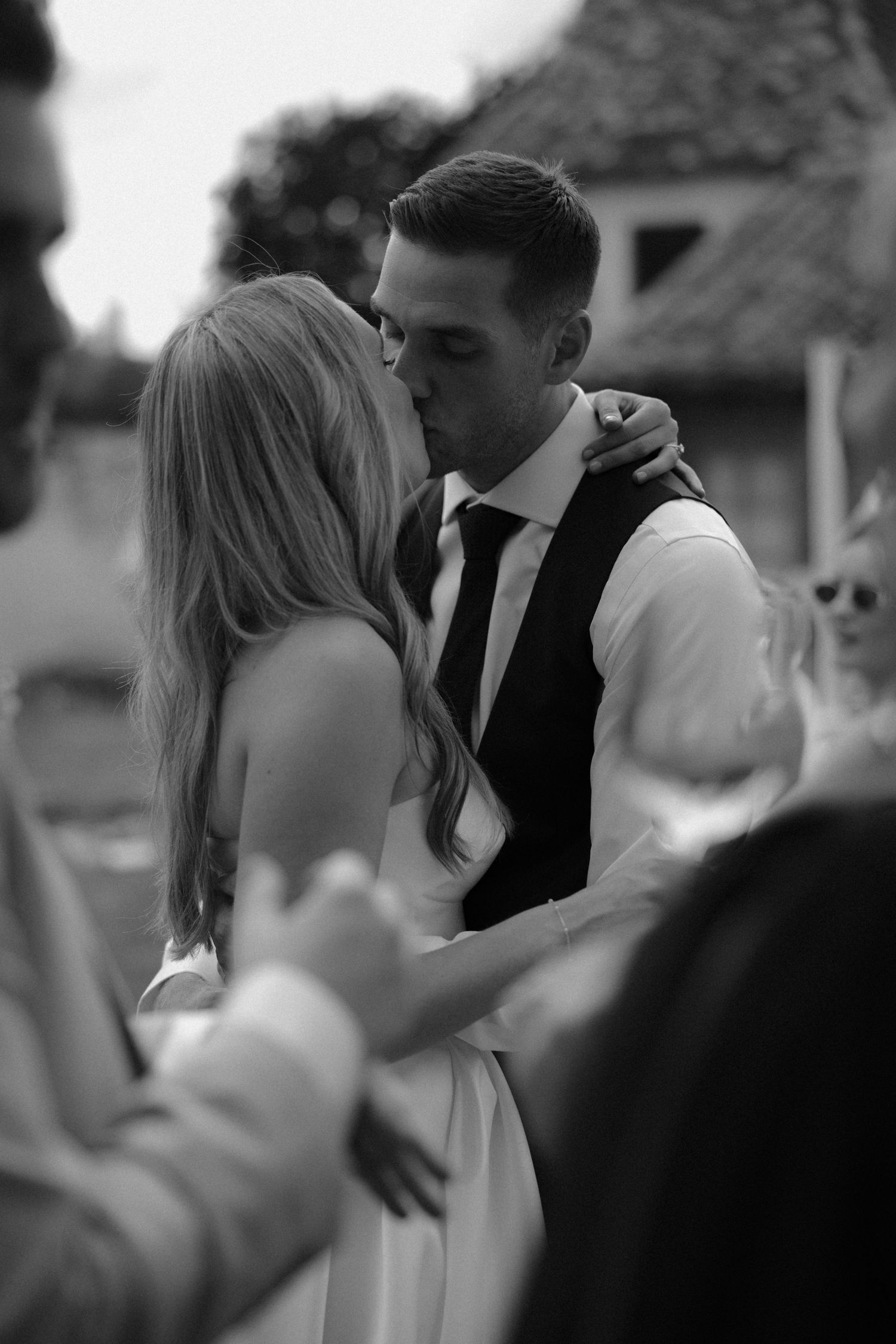 Black and white photo of couples dancing at wedding reception.