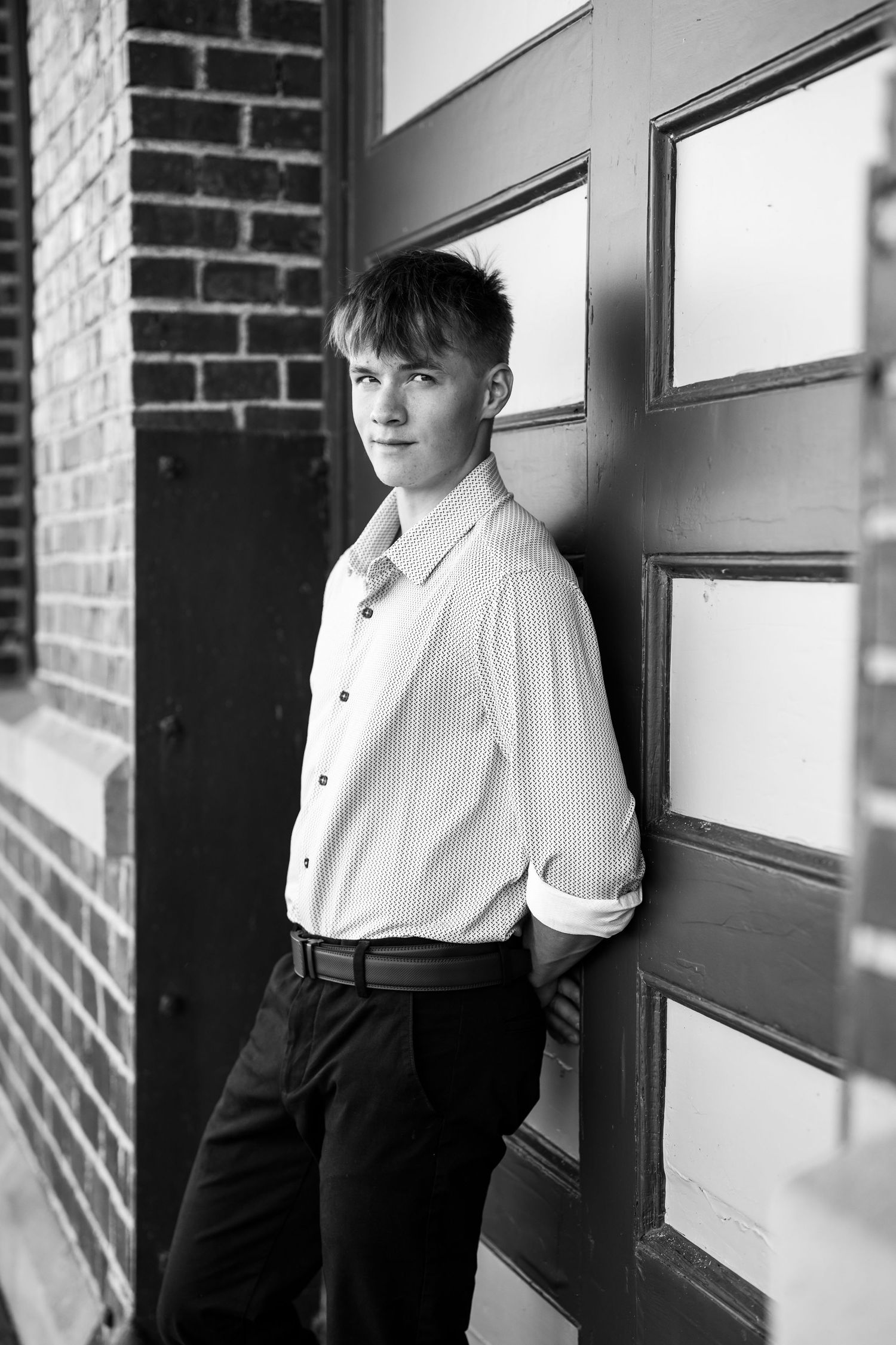 Classic black and white portraits showing formal attire against an architectural backdrop.