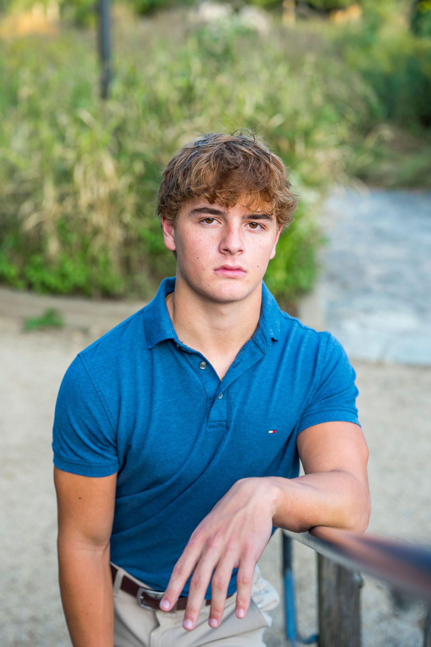 Natural light portrait series against green foliage background.