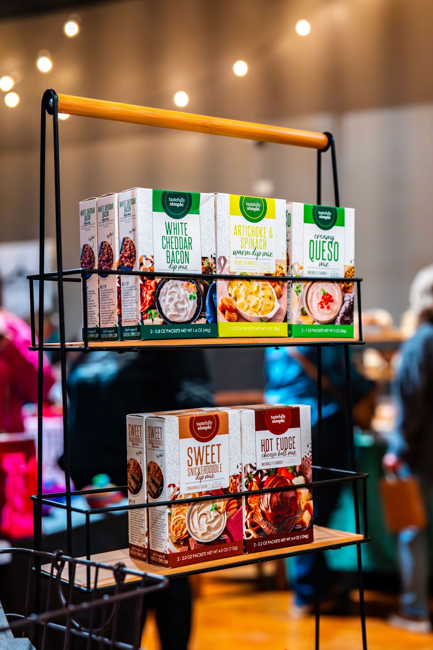 Shelves displaying various boxed food products in a marketplace with warm lighting.