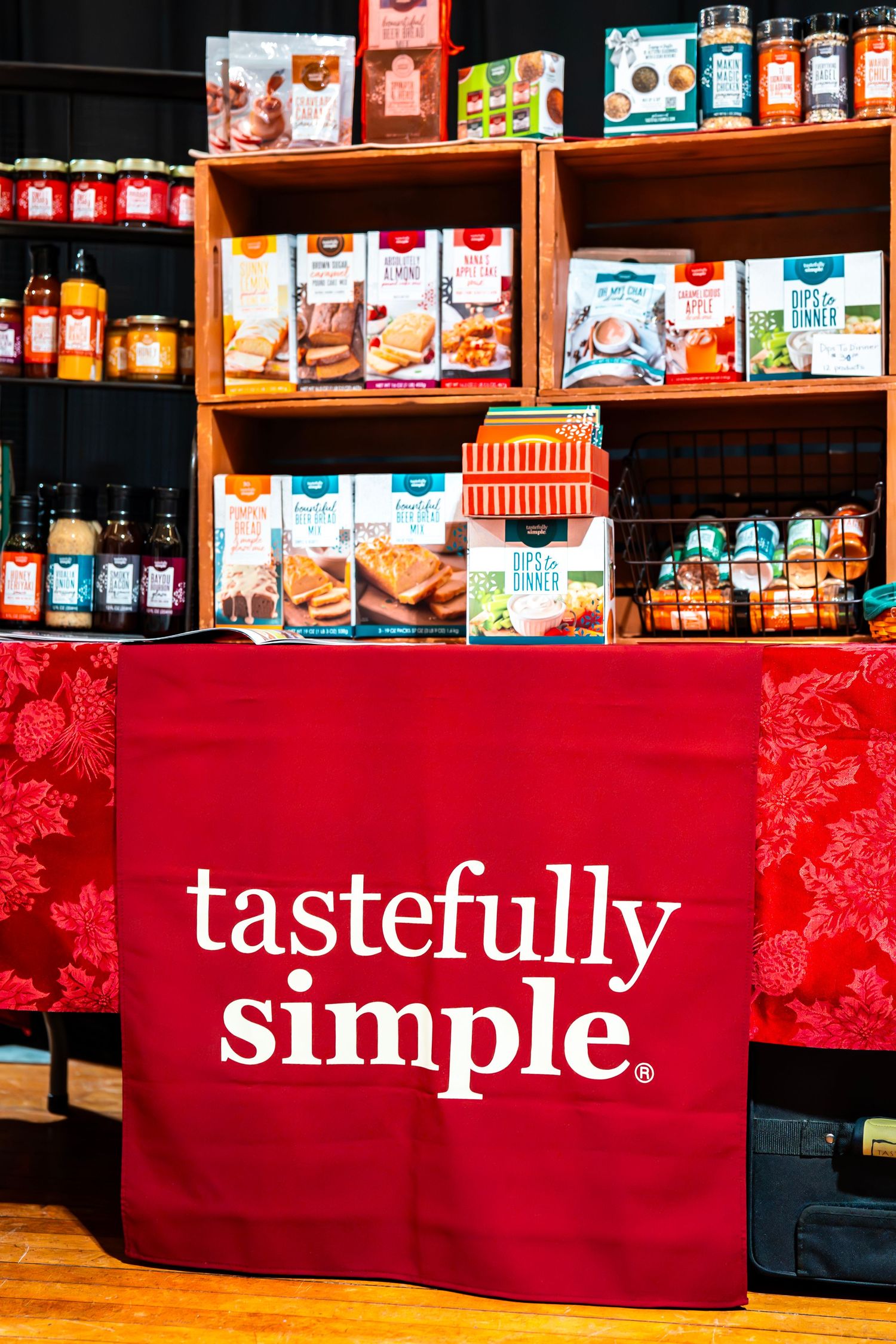 Retail display showing packaged food products with red banners and store branding.