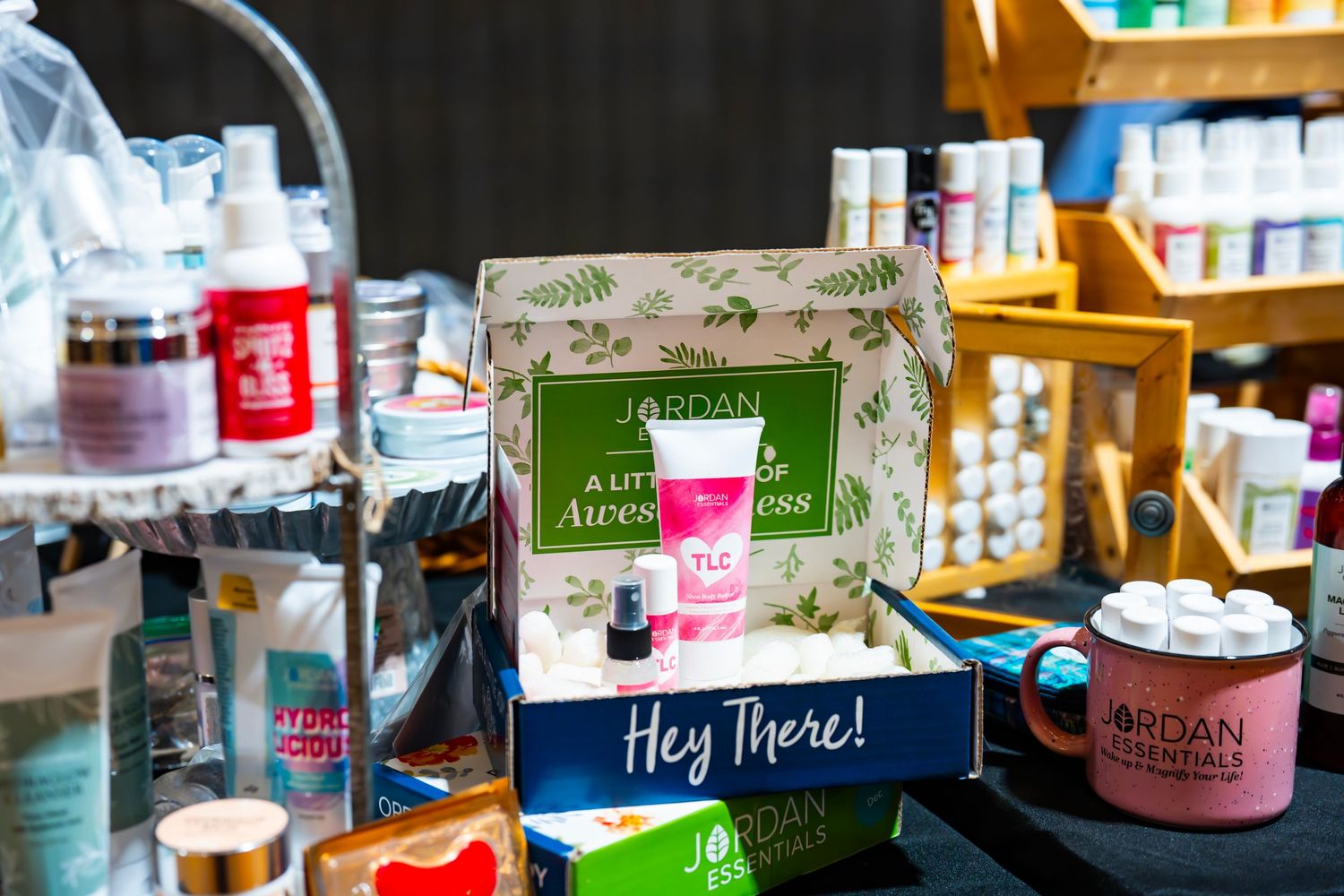 Beauty and skincare products lined up on display shelves at a market vendor booth.