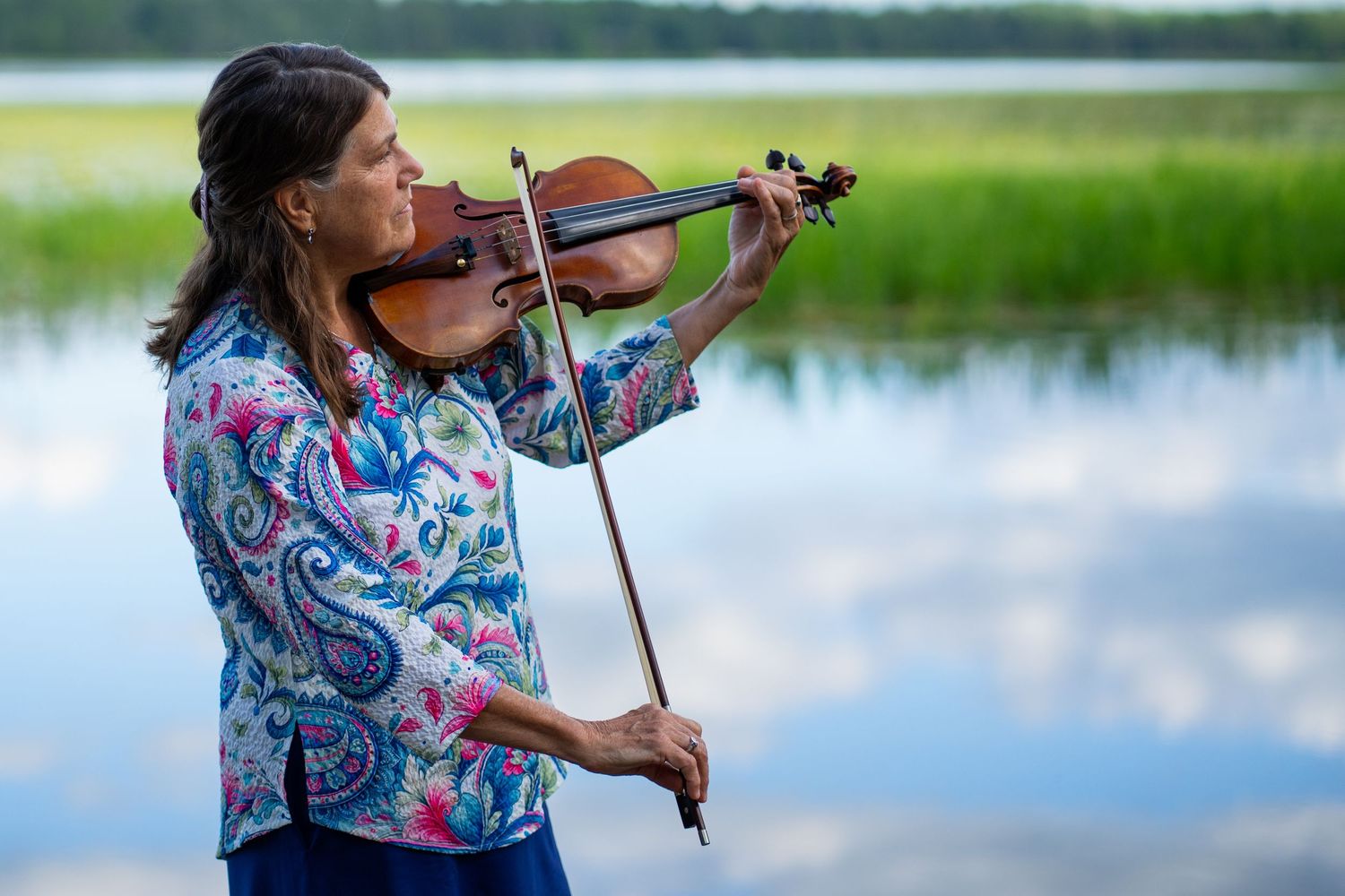 Violinist performing at the Mississippi Headwaters.