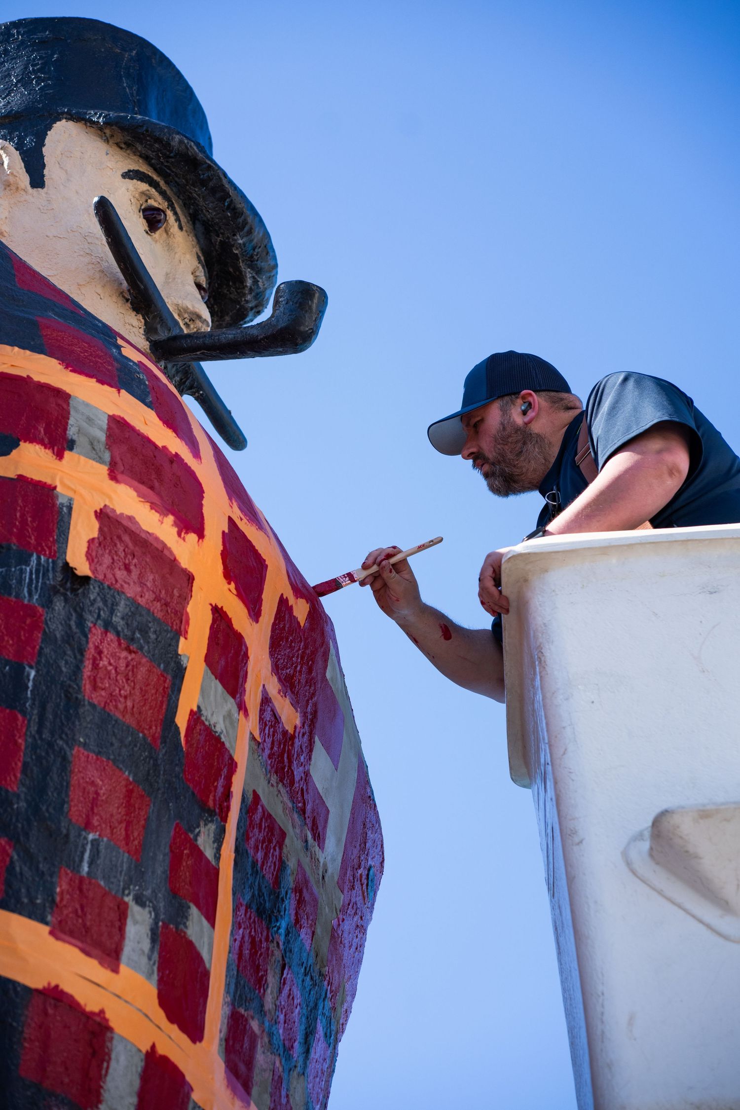 Close-up of maintenance work being done on Paul Bunyan Statue.