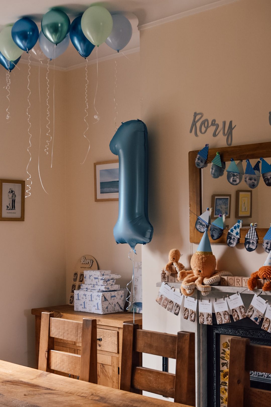 Child's 1st birthday party with blue balloon decorations