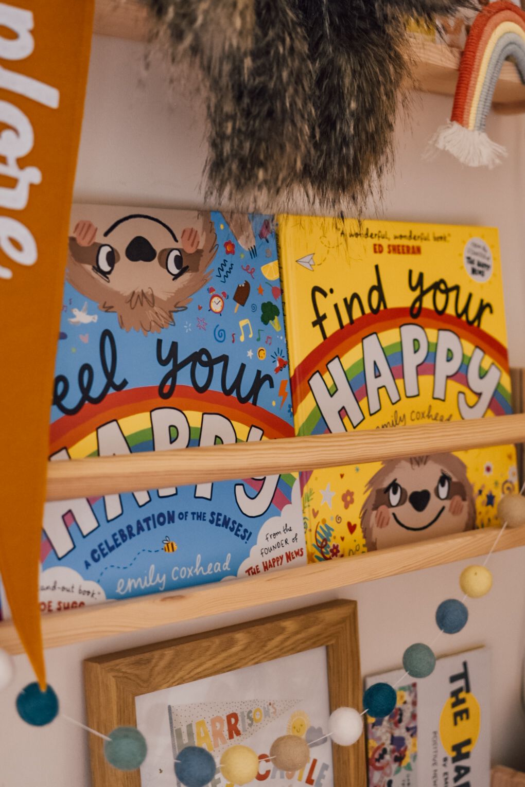 Bookcase with Feel your Happy and Find your Happy books by Emily Coxhead