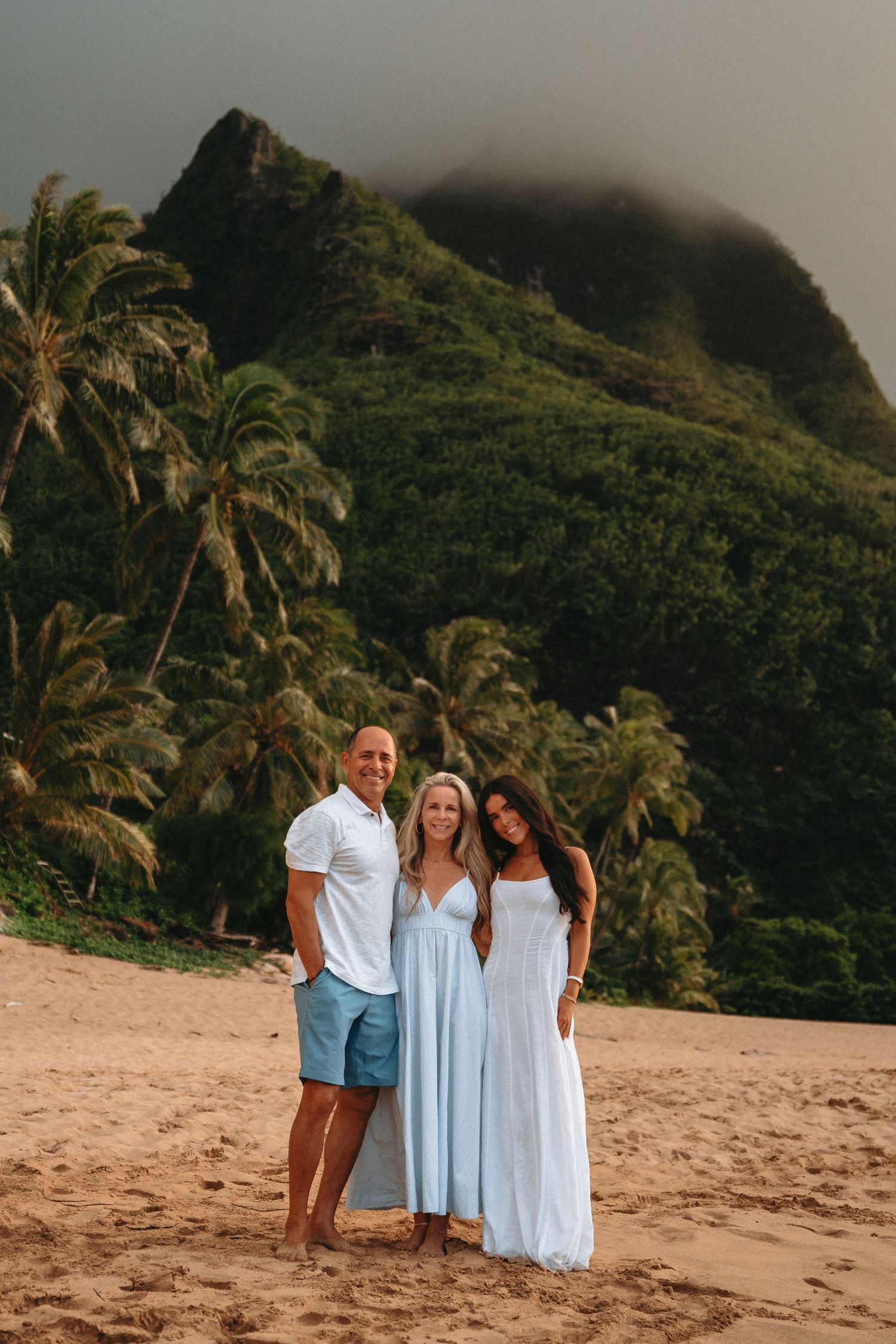 Kauai family sunset beach photos at Tunnels Beach with ocean views, golden light, and tropical Hawaii scenery.