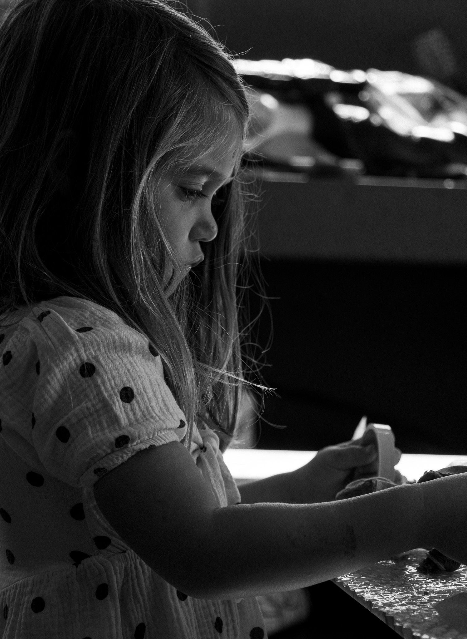 Emotional black and white documentary portrait of a child in Cape Town.