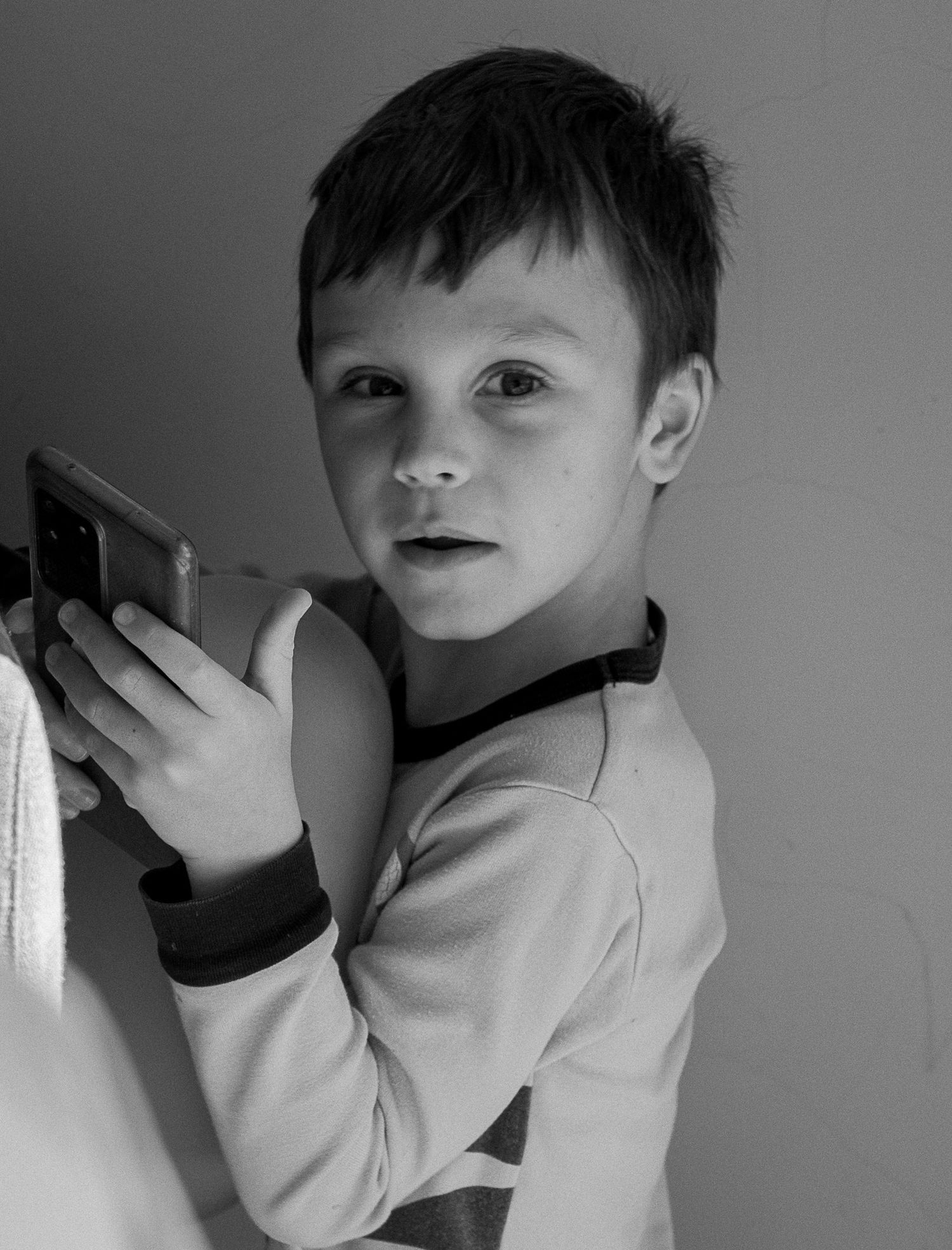 Emotional black and white documentary portrait of a child in Cape Town.