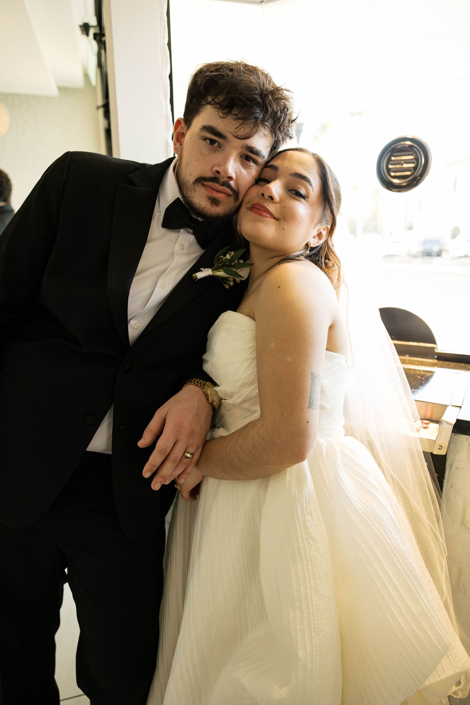 Artistic wedding portraits showing tender moments in natural light.