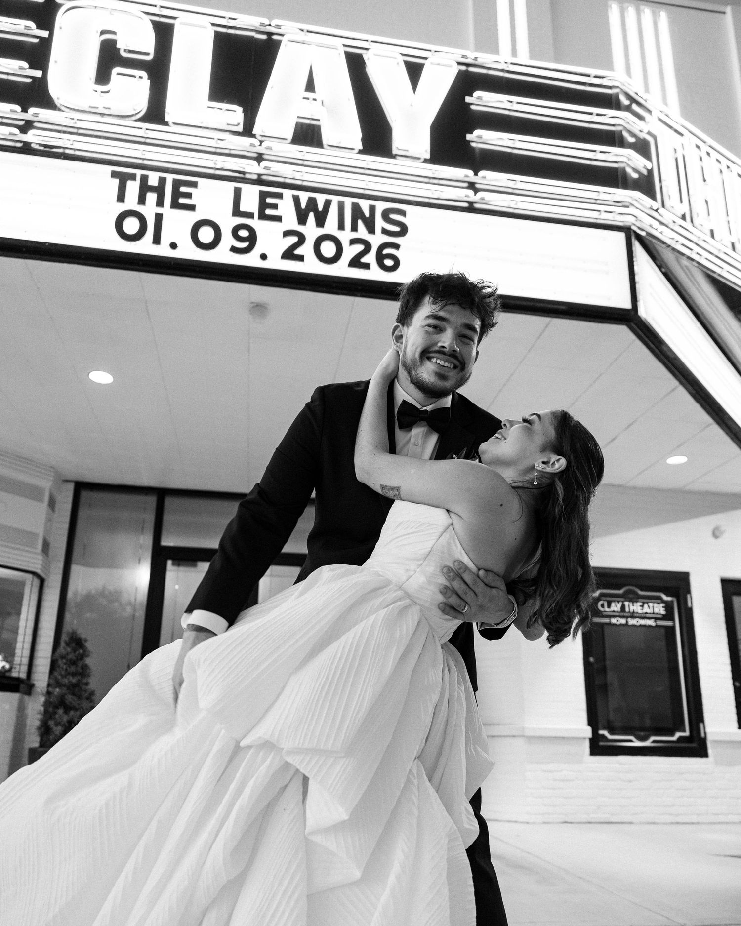 Romantic black and white photos under vintage theater marquee.