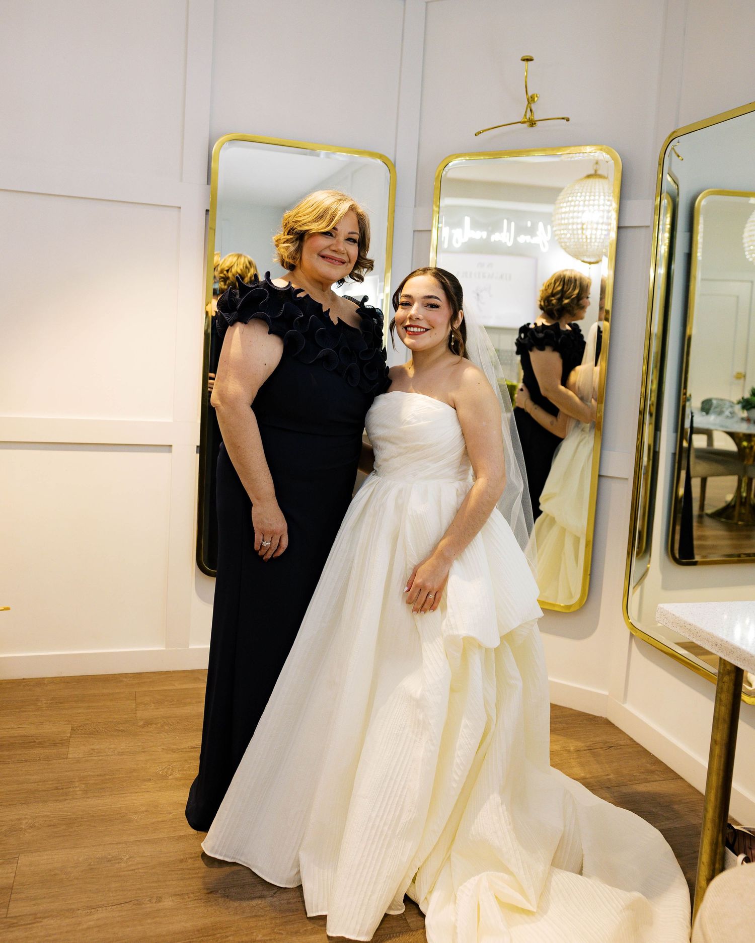 Bridal fitting session showing movement of a white wedding gown in a boutique setting.