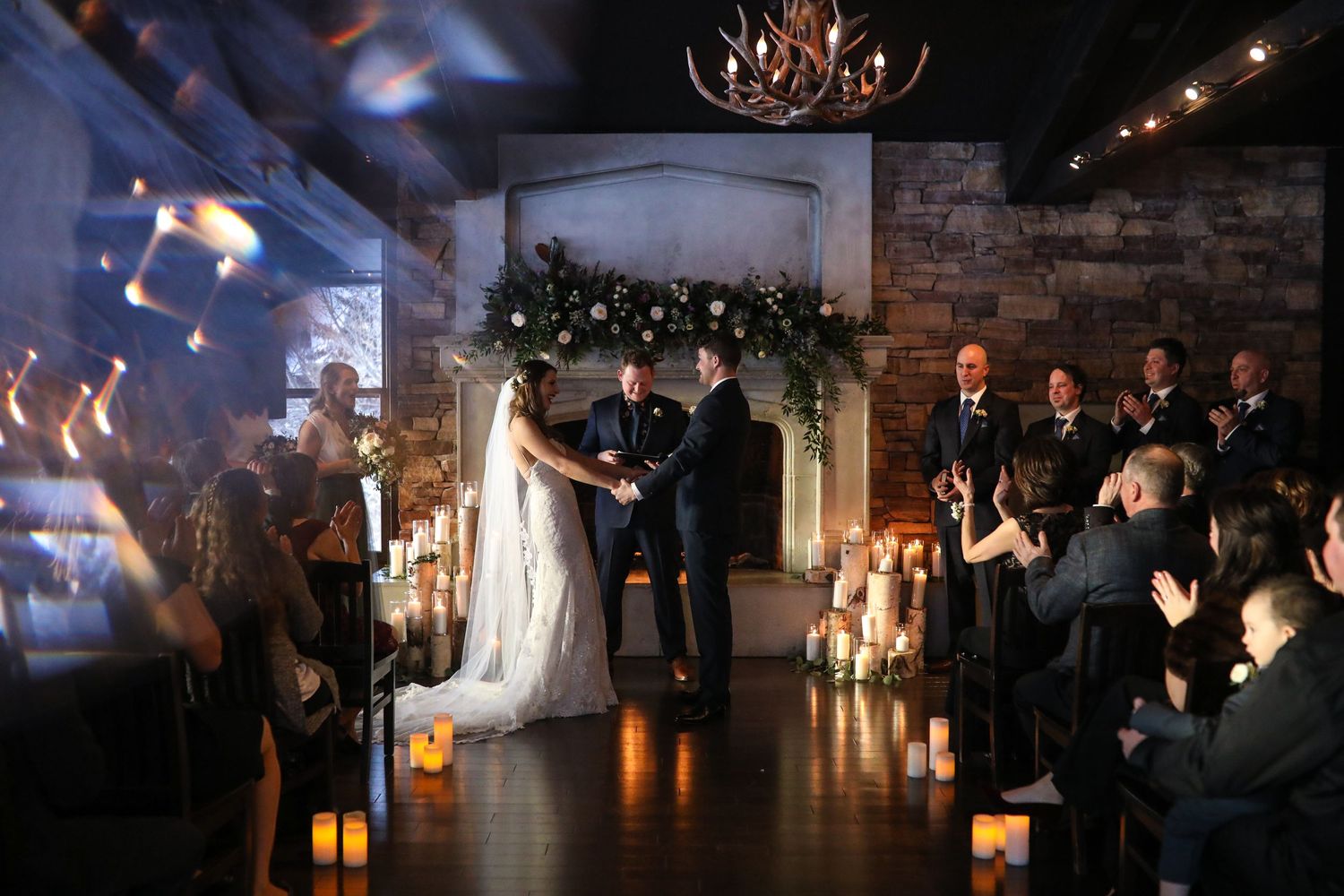 Wedding ceremony takes place in a romantic candlelit Lake house wedding venue in Calgary