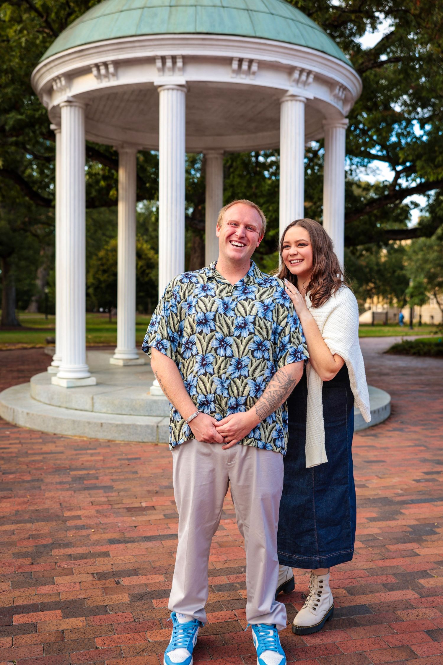 Panoramic series of romantic poses under a domed gazebo with white columns.