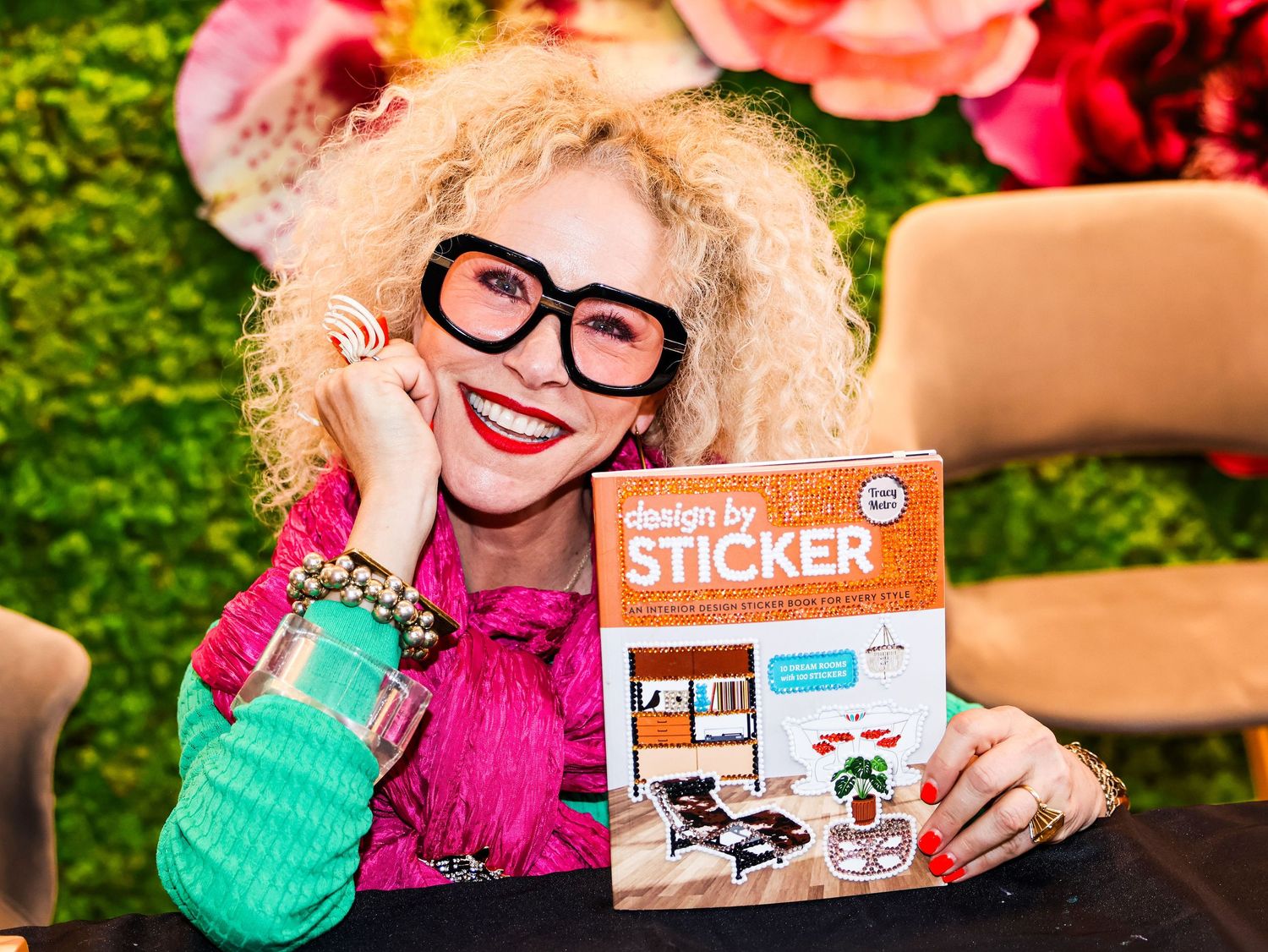 Playful scene with sticker products and colorful floral decorations.
