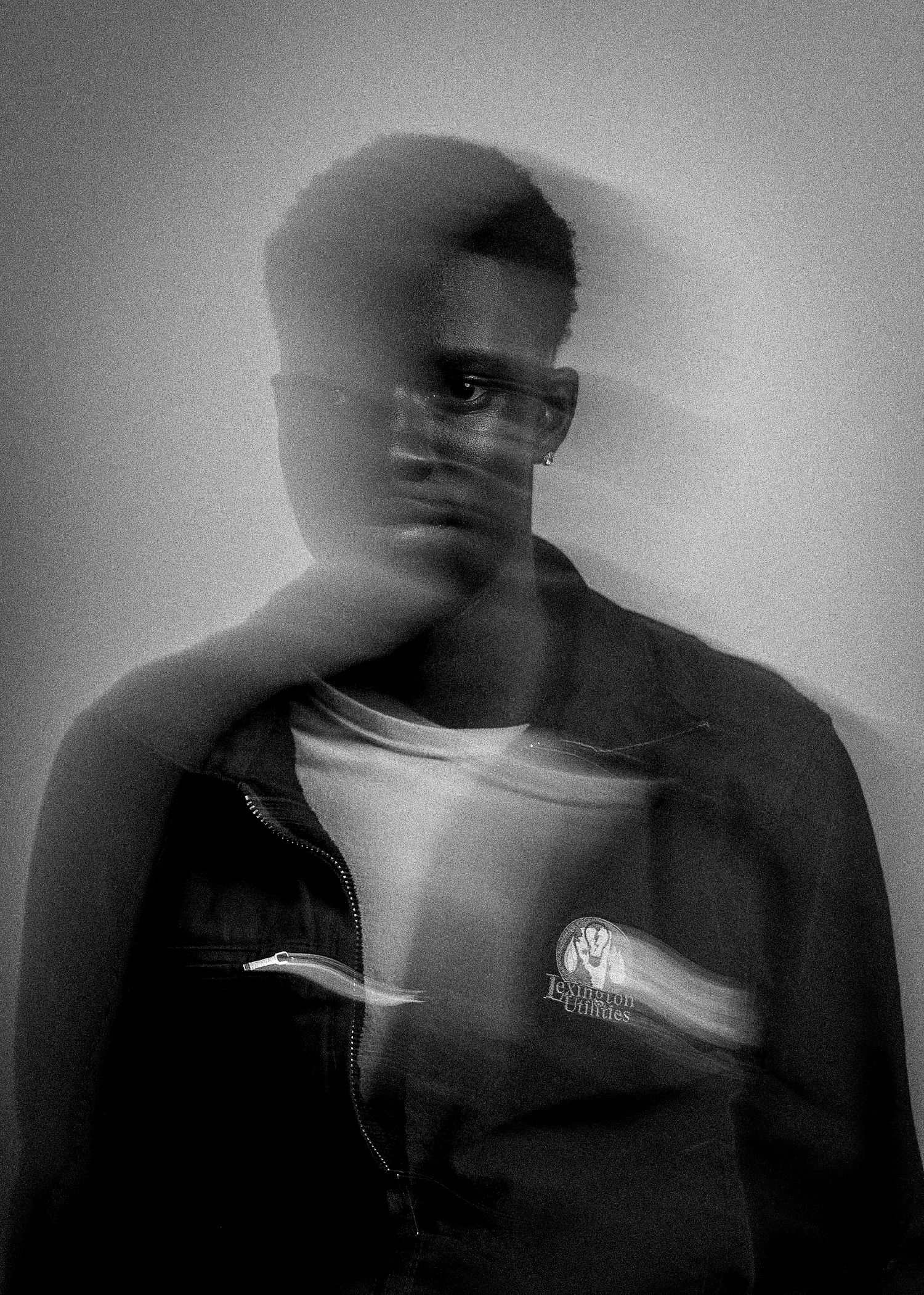 Artistic black and white motion blur portrait series showing movement and expression.