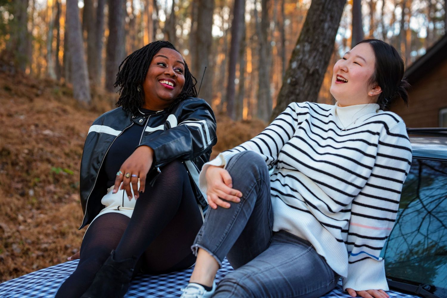 A group enjoying a fun photo session in an autumn forest setting.