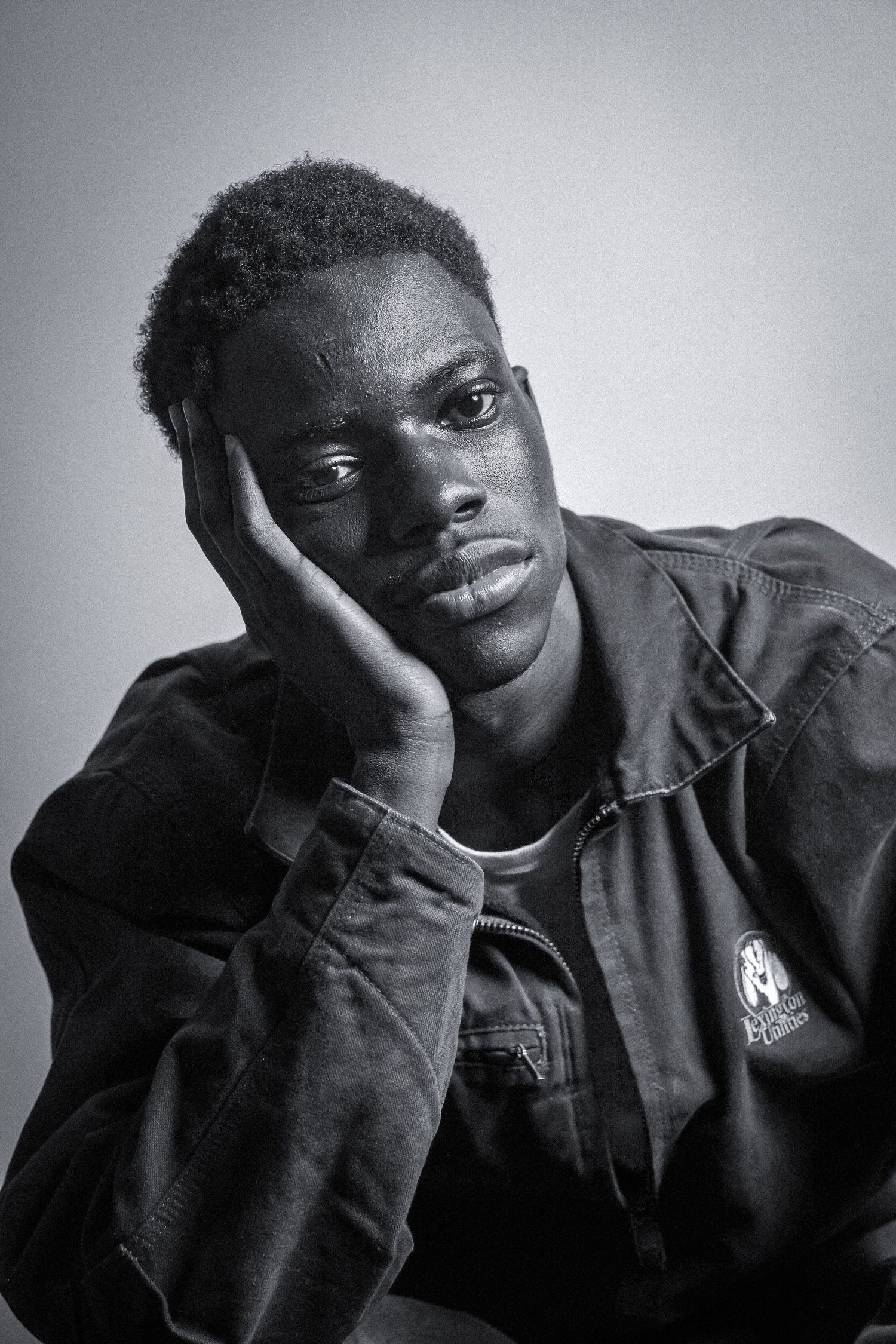 Black and white portrait series showing relaxed poses and natural expressions.