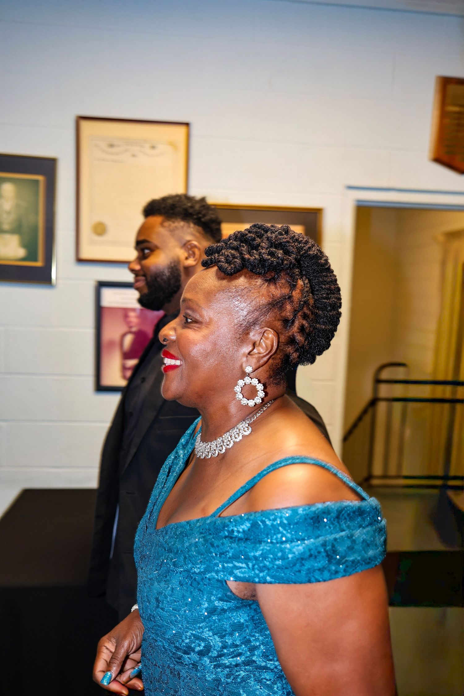 Party guests enjoying a celebration in formal attire.