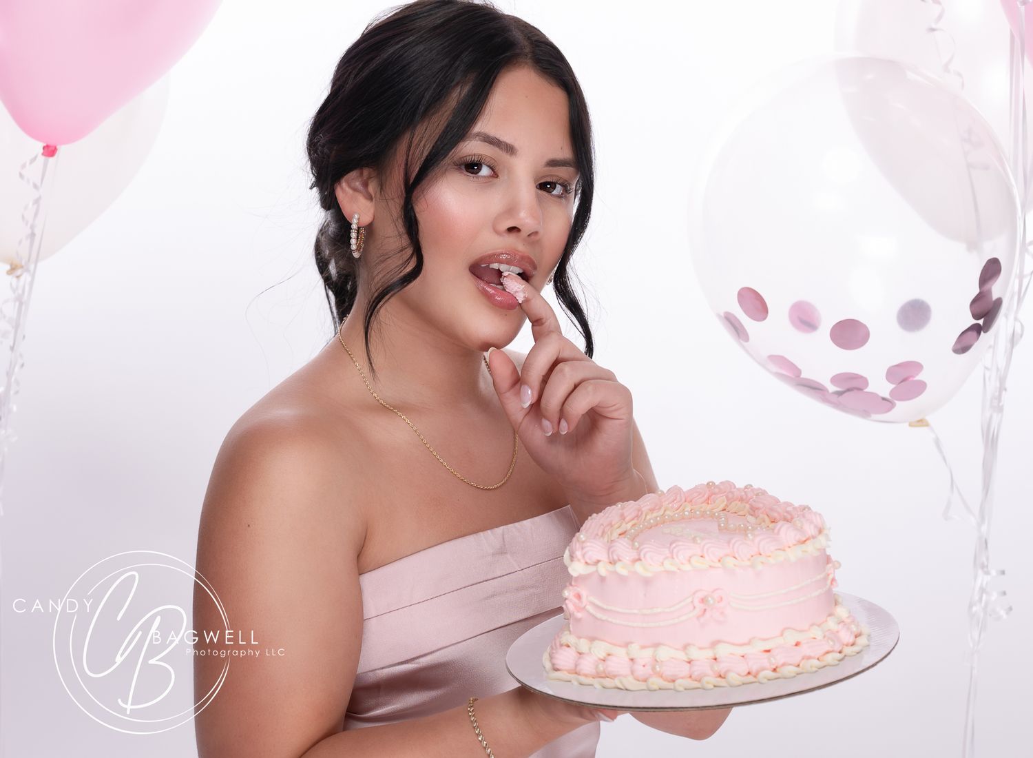 Elegant birthday studio portrait with a pink cake and balloons by Candy Bagwell Photography, serving Fletcher, Asheville, and Western NC.