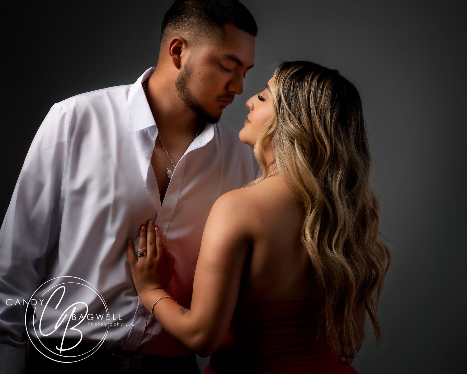 Intimate couples studio portrait with dramatic lighting and romantic styling by Candy Bagwell Photography, serving Fletcher and Western NC.