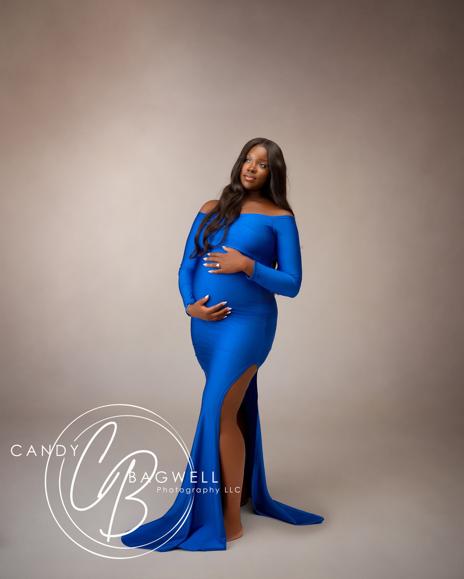 Elegant studio maternity portrait featuring an expecting mother in a blue gown by Candy Bagwell Photography in Fletcher, NC.