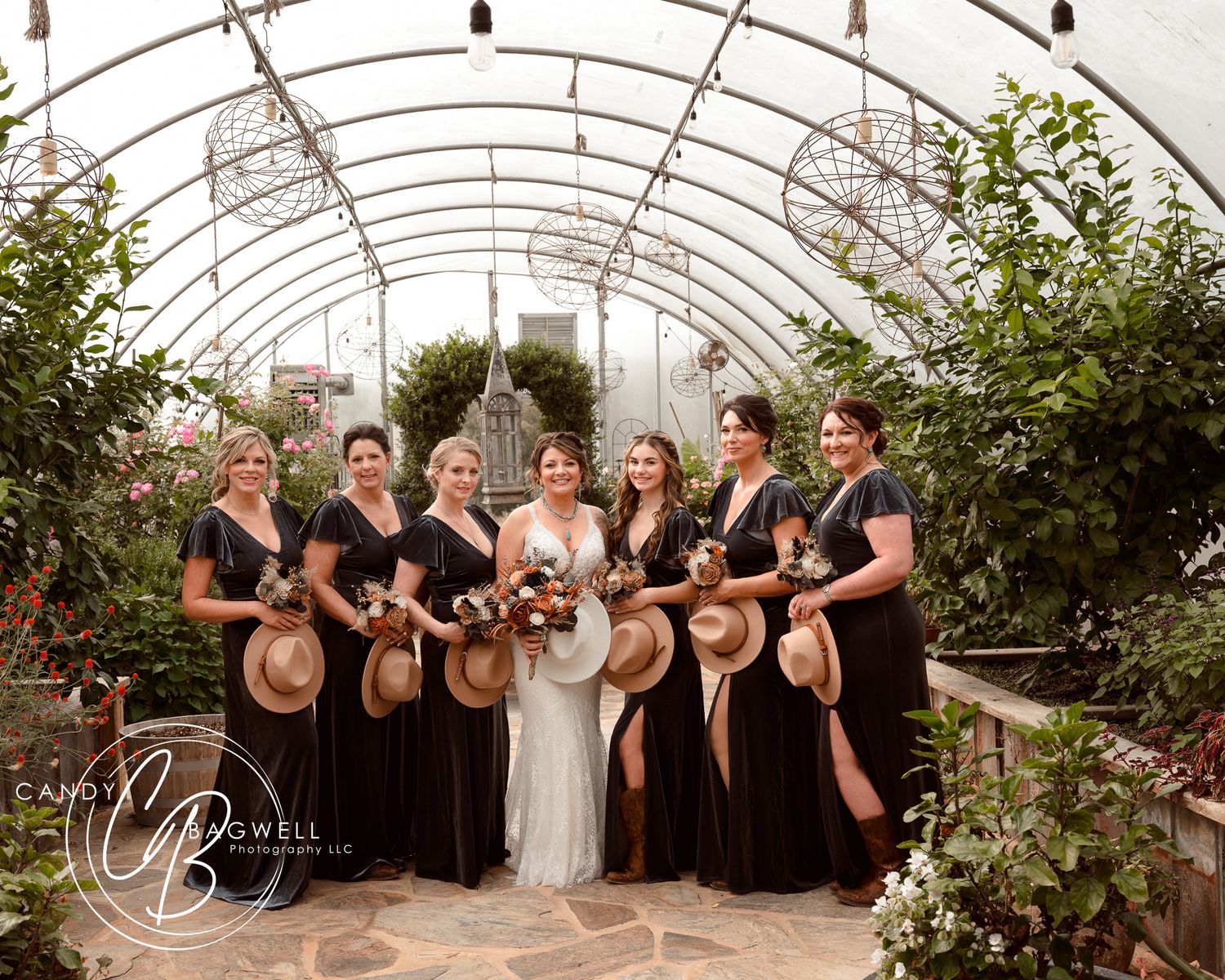 Wedding party portrait in a beautiful greenhouse setting by Candy Bagwell Photography, serving Fletcher, Asheville, and Western NC.