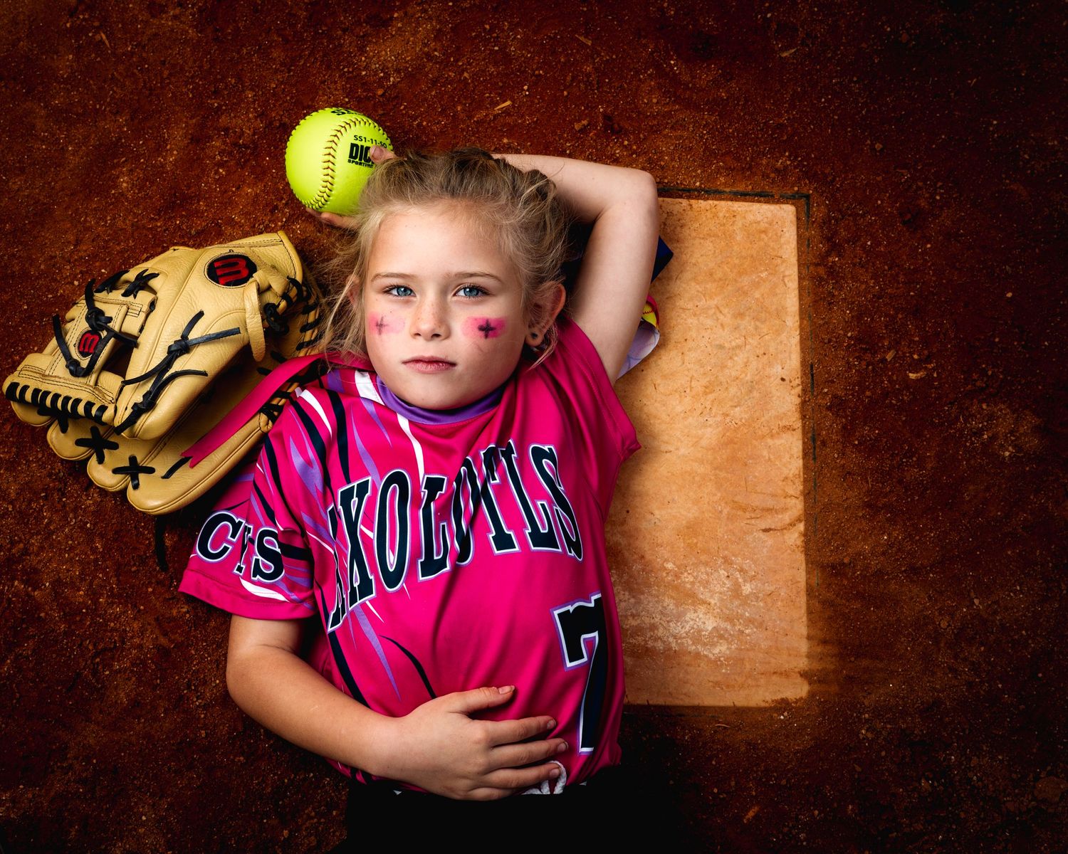 Creative sports portrait of a young softball player by Candy Bagwell Photography, serving Fletcher, Asheville, and Western NC.