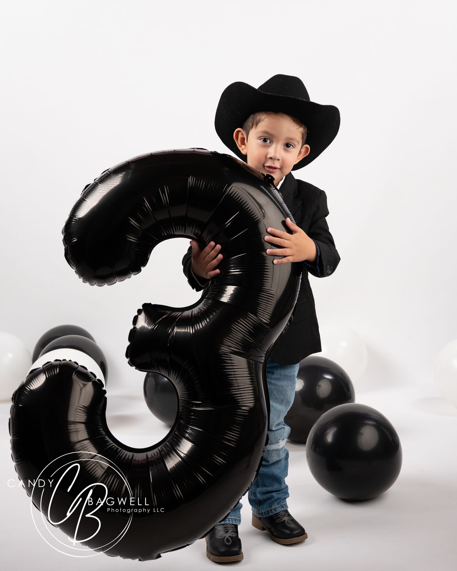 3rd birthday studio portrait with cowboy styling and balloons by Candy Bagwell Photography, serving Fletcher, Asheville, and Western NC.