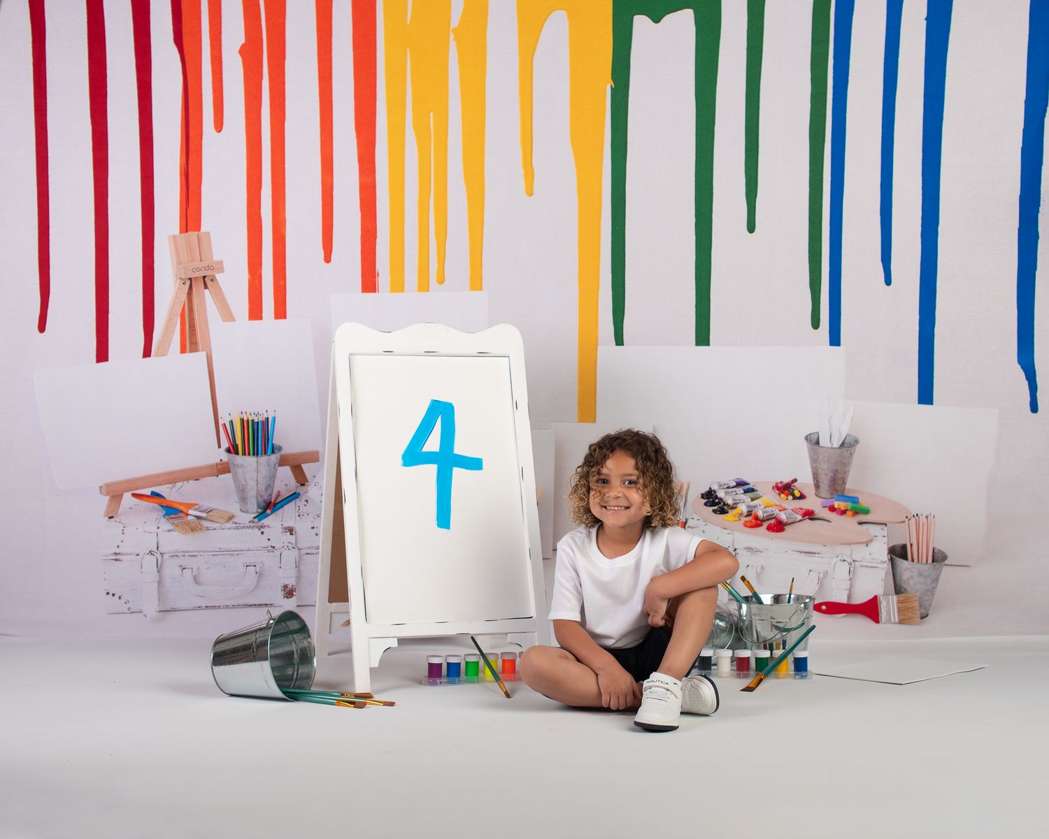 Colorful 4th birthday studio portrait with a fun art theme by Candy Bagwell Photography, serving Fletcher, Asheville, and Western NC.
