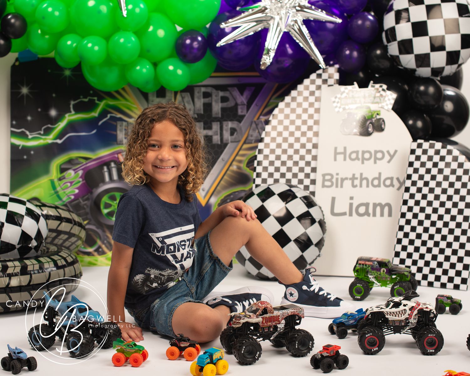 Monster truck birthday portrait with a colorful balloon setup by Candy Bagwell Photography, serving Fletcher, Asheville, and Western NC.