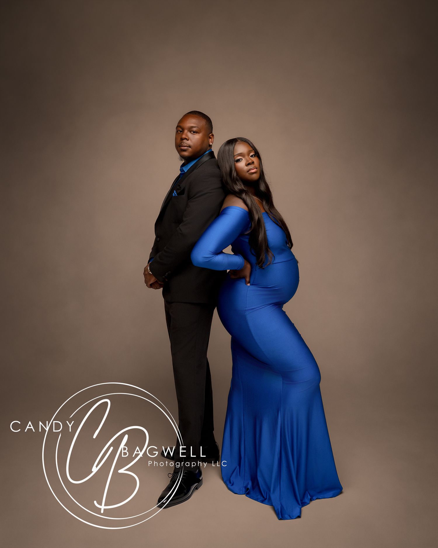 Luxury couples maternity portrait with an expecting mother in a blue gown by Candy Bagwell Photography in Fletcher, NC.