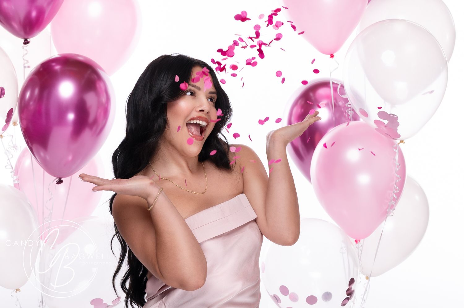 Fun birthday studio portrait with pink balloons and playful styling by Candy Bagwell Photography, serving Fletcher, Asheville, and Western N