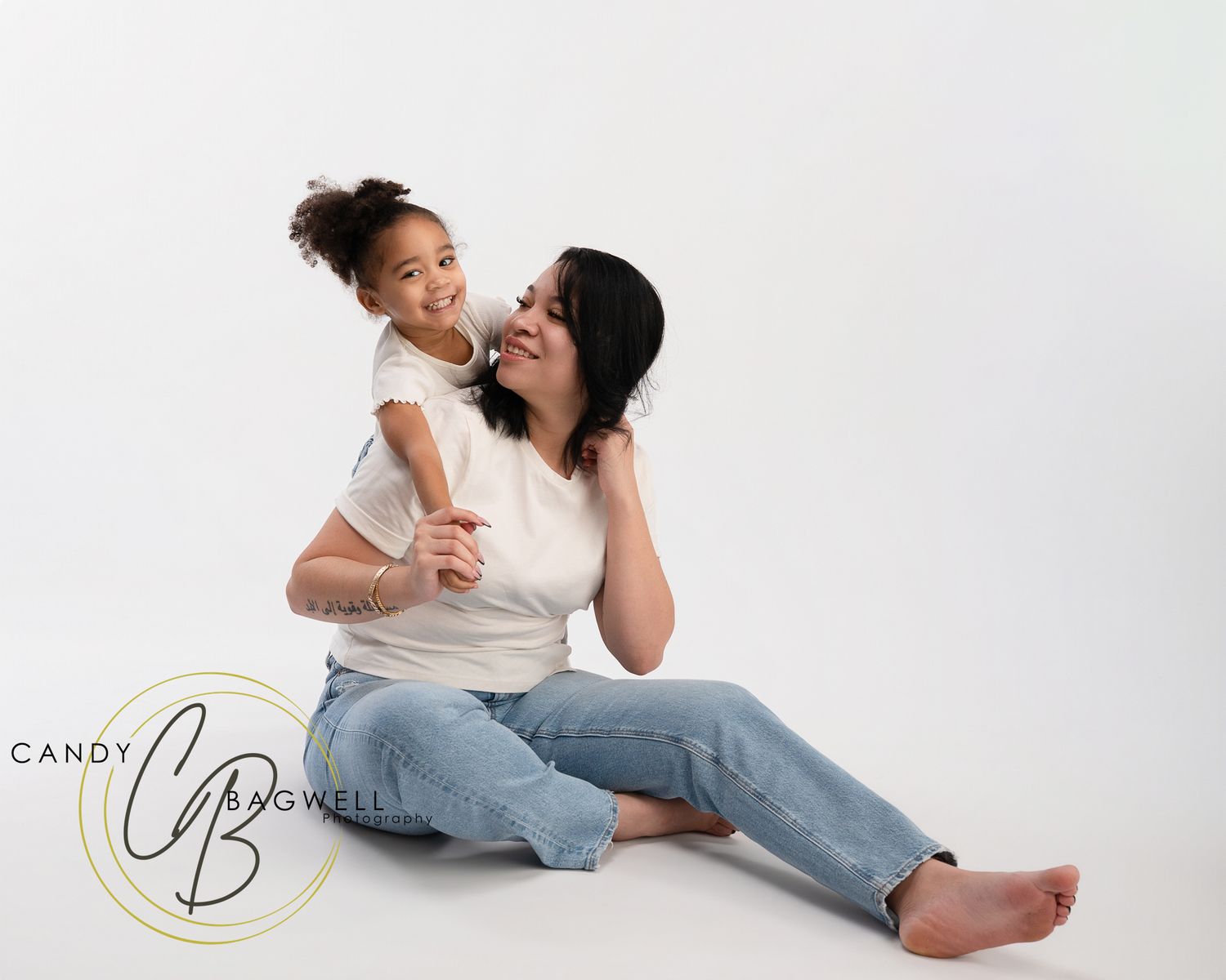 Mother and daughter studio portrait with natural posing by Candy Bagwell Photography, serving Fletcher, Asheville, and Western NC.