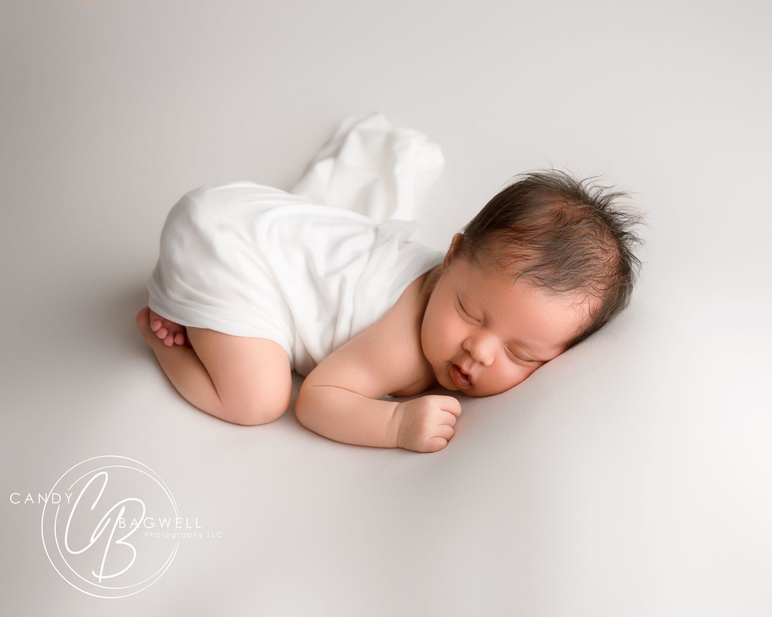 Simple posed newborn portrait by Candy Bagwell Photography, professional newborn photographer serving Fletcher, Asheville, and Western NC.