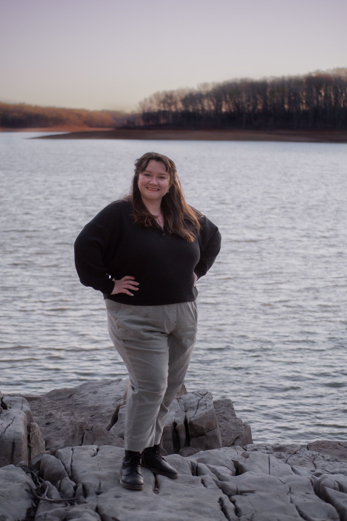 This is Staci on rocks near a lake