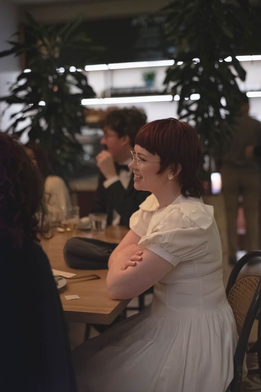 Bride sitting at reception table