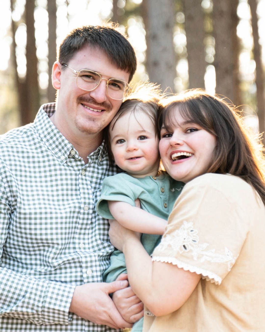 Mother and father holding child