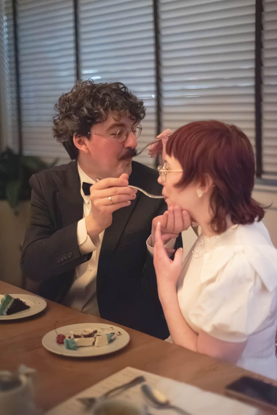 Bride and groom eating wedding cake